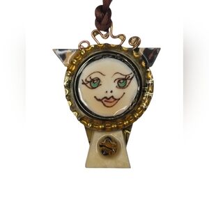 Artistic Face Pendant with Gold Accents
